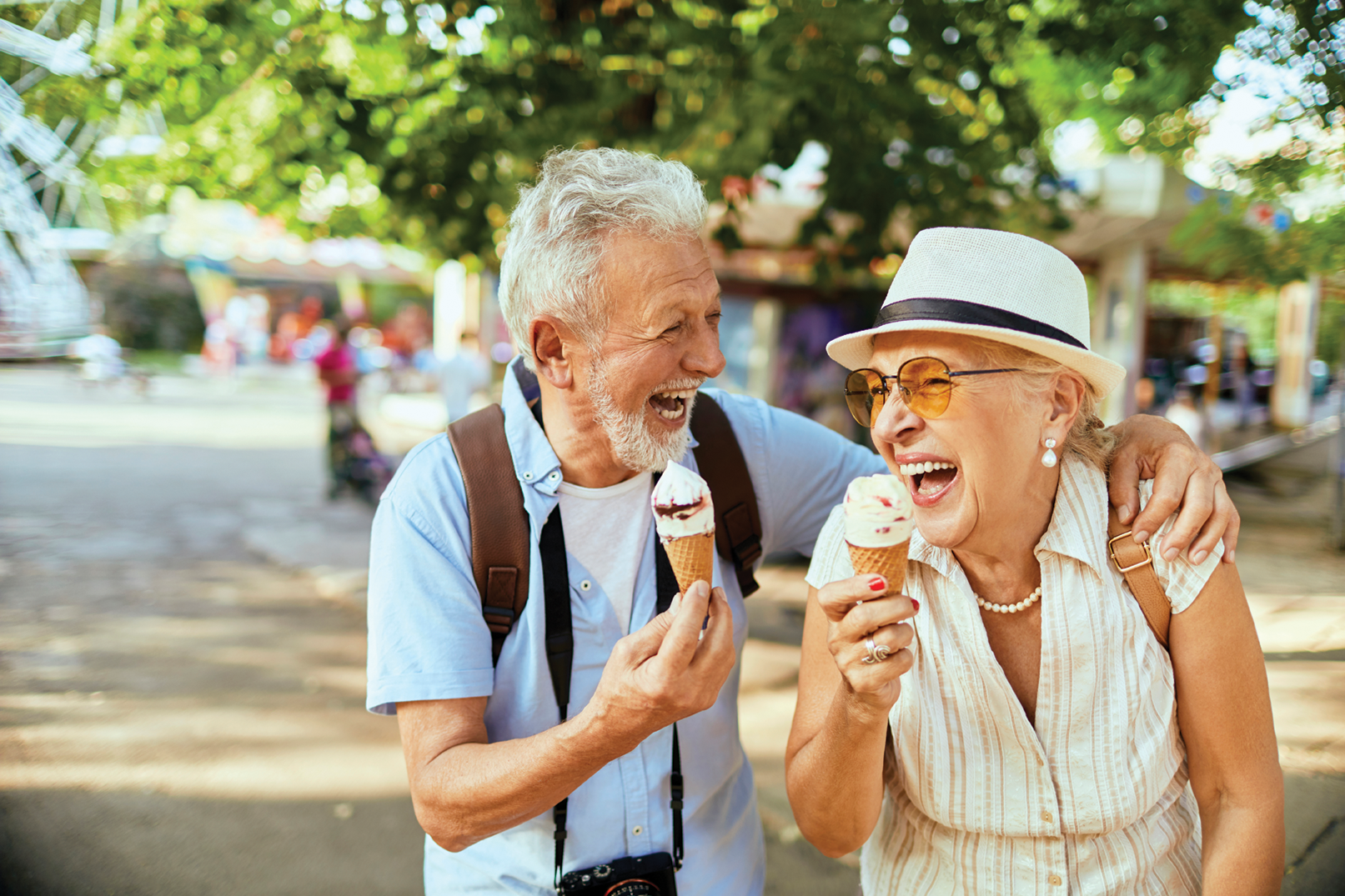 Two people enjoying ice cream and laughing